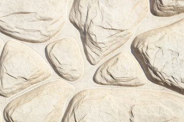 several white stones lie close to each other and form a common pattern