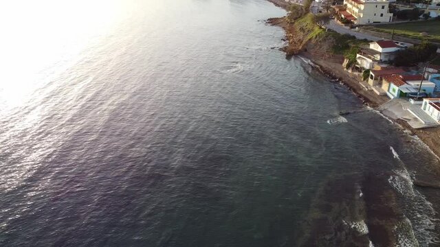Aerial view over the seaside near at Agia Ermioni's port in Chios Island, Greece at the Golden Hour