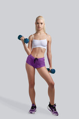 Fototapeta premium Beautiful fitness girl working out