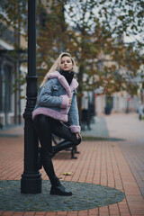 Fashion portrait of blonde girl in the city