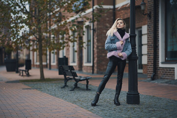 Fashion portrait of blonde girl in the city