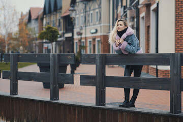 Fashion portrait of blonde girl in the city