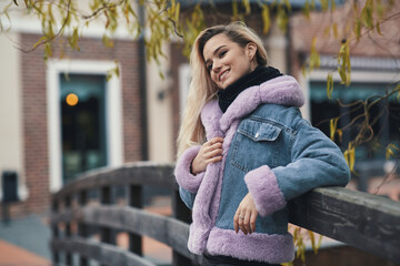 Fashion portrait of blonde girl in the city