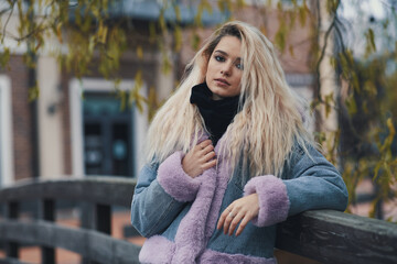 Fashion portrait of blonde girl in the city