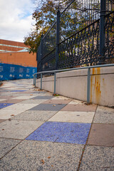 Blue and orange path with metal railing