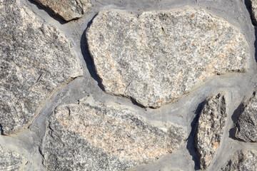 stones similar to marble of different shapes and sizes are folded into a pattern