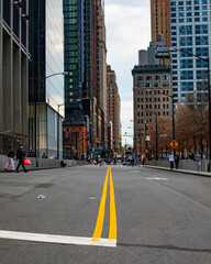 Fototapeta premium Looking down city road from the center