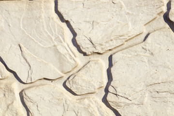 shallow cracks spread over stones