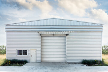 Fototapeta na wymiar Steel Shutter Roller Door of Factory Warehouse Workshop for Materials Storage, Front View of Rolling Metal Doors for Access and Security. Gate Building Structure of Warehouses for Store