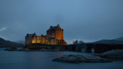 Naklejka na ściany i meble Eilean Donan Castle, Scotland, Uk, Highlands. Image after a storm at blue hour