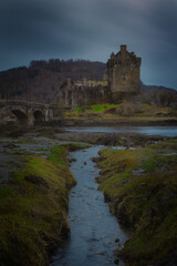 Fototapeta na wymiar Eilean Donan Castle, Scotland, Uk, Highlands. Image after a storm when the clouds opened.
