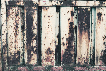 Old rusty metal background, dirty rough surface, peeled cracked white paint, material exposed to atmospheric influences