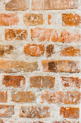 Vintage old wall from red brickwork close-up, grungy textured background from rectangular blocks. Grungy texture for 3d design