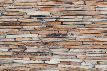 Old walls thin sandstone slabs close-up, masonry layered, vintage stone wall background. Grungy texture for 3d design