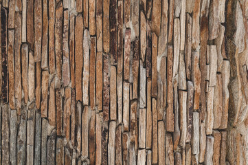 Vintage old wall thin sandstone stone slabs, masonry is layered, textured stone surface background. Grungy texture for 3d design