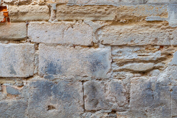 Antique wall background with peeling decorative plaster, vintage background rough textured surface, antique material.