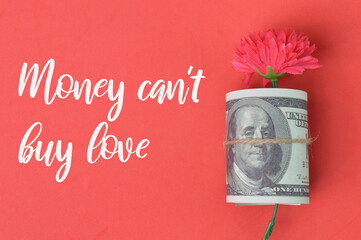 MONEY CAN'T BUY LOVE quote over red background.