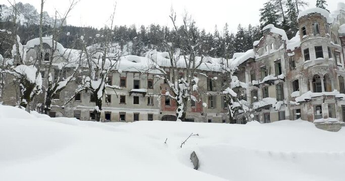 Ruins of San Candido Grand Hotel Wildbad in South Tyrol, Italy covered with snow