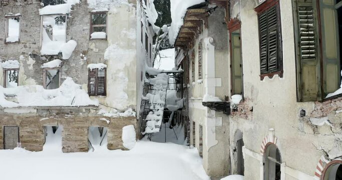 Dolly shot to reveal ruined building of Grand Hotel Wildbad in San Candido Italy