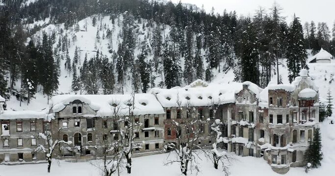 Creepy ruins of luxury hotel in Italian Alps, South Tyrol, aerial view