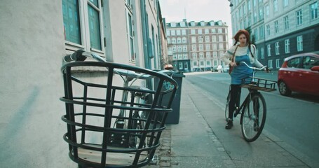 Woman almost falling off her bicycle