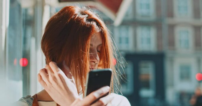 Young beautiful redhead taking a selfe