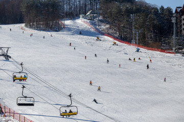 Alpencia, South Korea, 2016 - Olympic Village for the 2018 Winter Olympics. Tourists ski and...