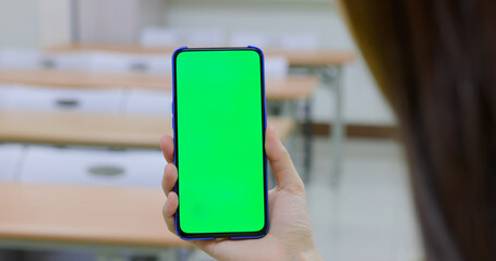 woman use green screen smartphone