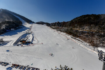 Alpencia, South Korea, 2016 - Olympic Village for the 2018 Winter Olympics. Tourists ski and...