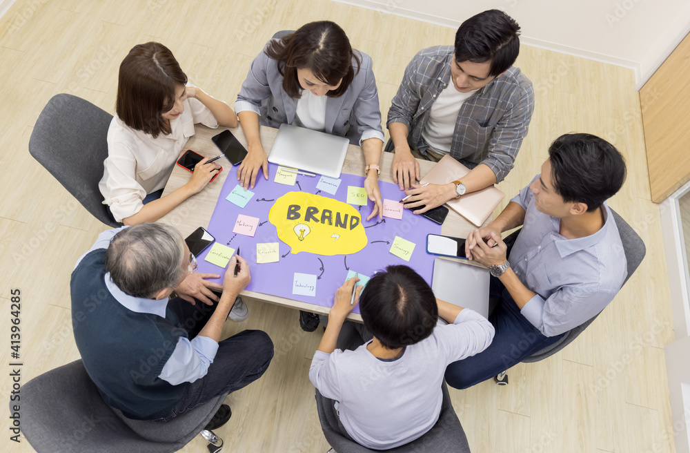 Sticker coworkers discuss at table