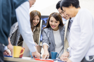 Coworkers discuss at table