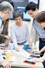 Coworkers discuss at table