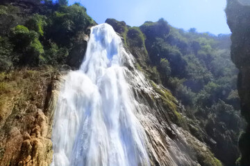 Chiapas, México; 2016: Beautiful turquoise waterfall landscape background