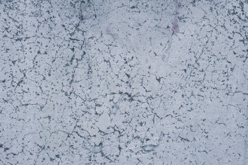 Background from old white walls, textured rough surface with small cracks, outdoor atmospheric exposure. Horizontal photography close-up