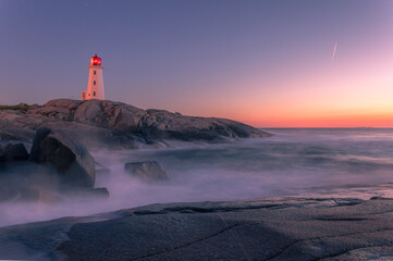 A dramatic sunset at Peggy's Cove Lighthouse Atlantic Coast Nova Scotia Canada. The most visited...