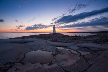 The Peggy's Cove Lighthouse landscape along the rugged rocks of the Atlantic Coast Nova Scotia Canada. The most visited tourist location in the Atlantic Canada and famous Lighthouse captured with vibr © Prashanth Bala