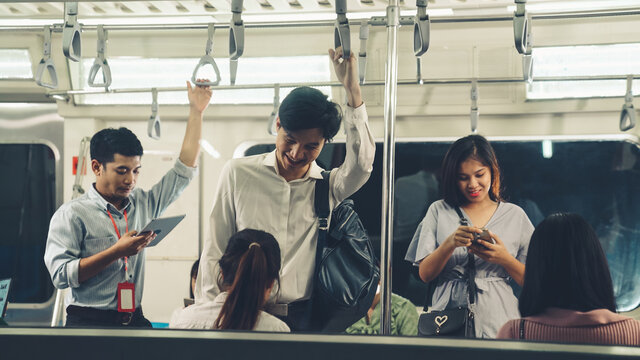 Crowd Of People On A Busy Crowded Public Subway Train Travel . Commuting And Urban Lifestyle Concept .