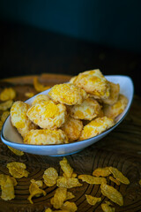Homemade Cornflake cookies on a wooden background.