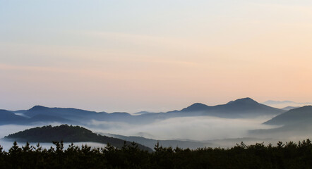 foggy mountain landscape at sunset