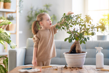 child is caring for plants