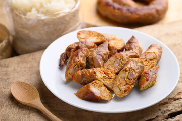 Northern Thai sausage (Sai Aua), Grilled intestine stuffed with minced pork, spices and herbs,...