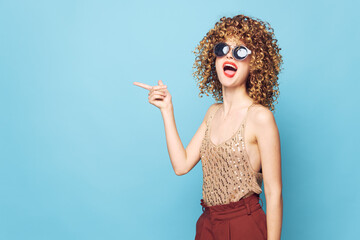 Fototapeta premium Model Curly hair red lips gesture hands emotions model bright makeup 