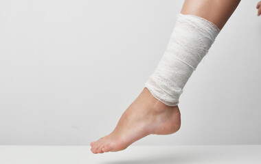 bandaged leg injury medicine gray background problems