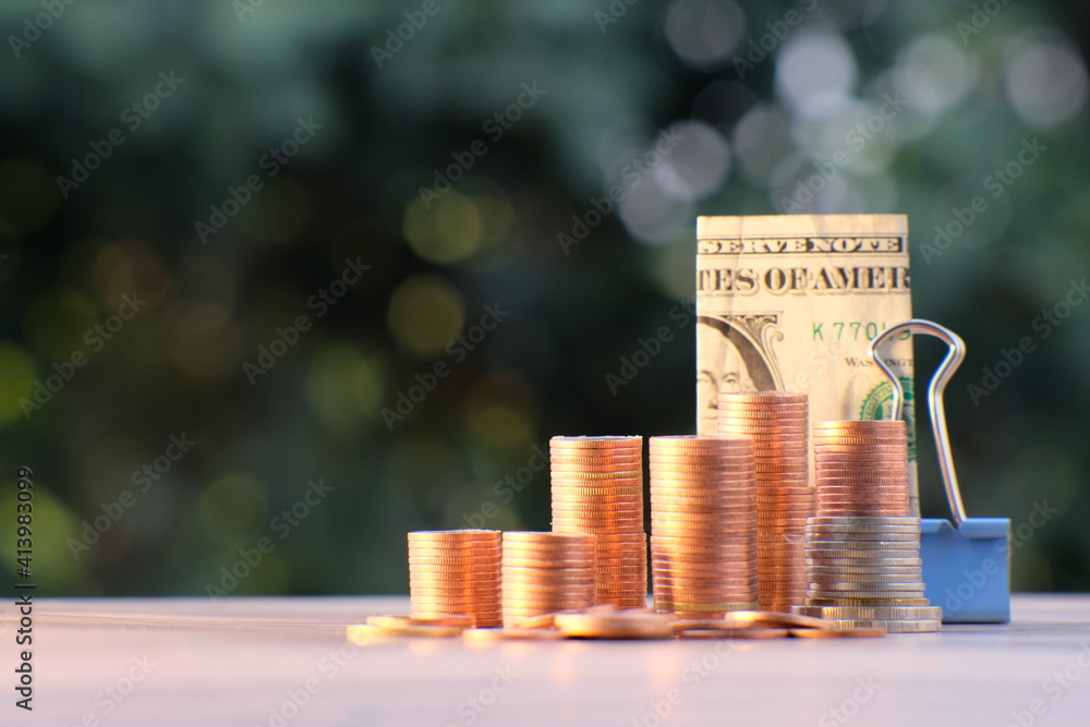 Poster stack of coin on table background and business or finance saving money