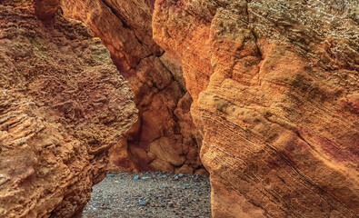 Photo of crevice between red rocks on the Black Sea coast