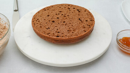 Chocolate cake with chocolate cake frosting and apricot jam topping step by step recipe. Ingredients close up