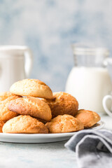 Freshly baked homemade crunchy cream cheese cookies. A delicious treat for gourmets. Biscuits on a grey concrete background. Biscuit.  Biscuits texture