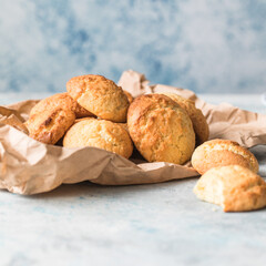 Freshly baked homemade crunchy cream cheese cookies. A delicious treat for gourmets. Biscuits on a grey concrete background. Biscuit.  Biscuits texture
