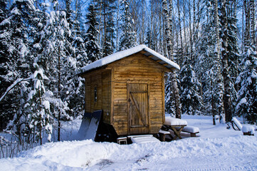 Wooden gazebo in the winter forest at the camping. 25 February 2021. Minsk, Belarus