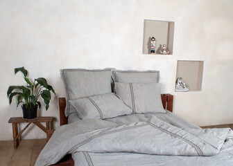 bed with linen and linen pillows